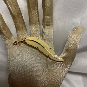 Vintage Monet Gold Tone Curved Soft Yellow Enamel Feather Brooch